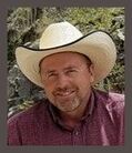 Steve Hale, smiling white male, mid-50's, wearing white cowboy hat and red shirt, with soft smile